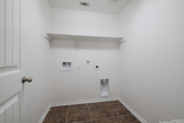 11750 Caraway, San Antonio, TX 78245 - washroom with hookup for an electric dryer, washer hookup, hookup for a gas dryer, and dark tile patterned floors