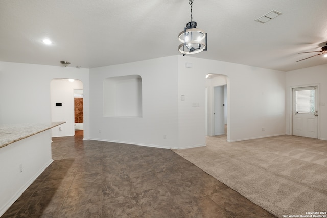 11750 Caraway, San Antonio, TX 78245 - unfurnished living room featuring arched walkways and a ceiling fan