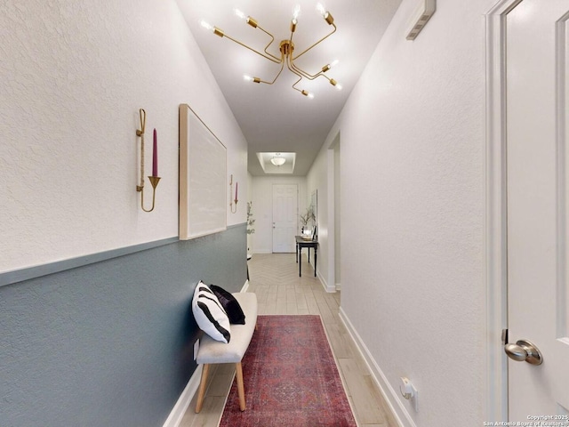 7621 Cypress, Boerne, TX 78015 - hallway featuring a chandelier and light wood-style floors