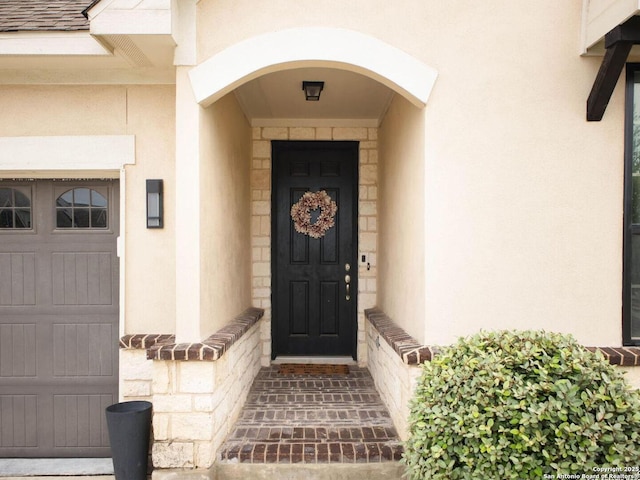 7621 Cypress, Boerne, TX 78015 - entrance to property featuring stucco siding, a garage, and stone siding