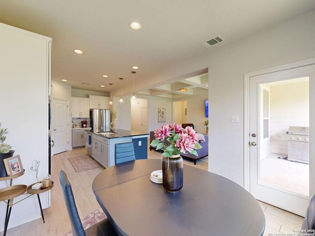 7621 Cypress, Boerne, TX 78015 - dining space with recessed lighting and light wood-type flooring
