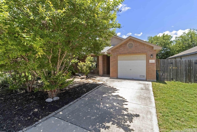 8611 Shaenfield, San Antonio, TX 78254 - view of front of home with concrete driveway, a garage, and brick siding