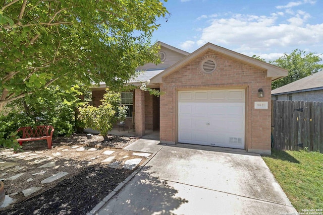 8611 Shaenfield, San Antonio, TX 78254 - view of front of property featuring brick siding, driveway, and a garage