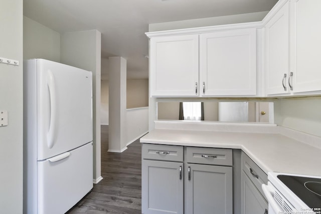 8611 Shaenfield, San Antonio, TX 78254 - kitchen featuring white appliances, light countertops, dark wood-type flooring, and gray cabinets