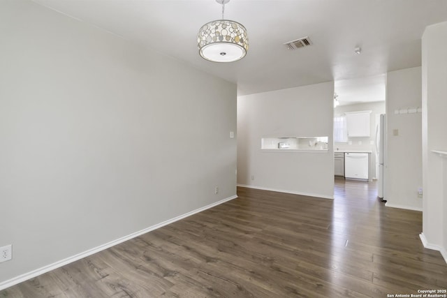 8611 Shaenfield, San Antonio, TX 78254 - unfurnished living room with dark wood-type flooring and baseboards