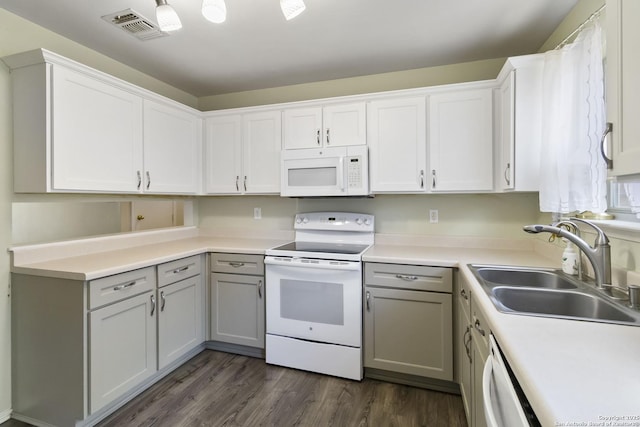 8611 Shaenfield, San Antonio, TX 78254 - kitchen featuring white appliances, dark wood-style floors, gray cabinetry, and light countertops