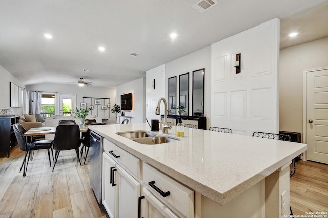 13019 Louberg, San Antonio, TX 78253 - kitchen featuring light wood-style floors, open floor plan, a ceiling fan, stainless steel dishwasher, and an island with sink