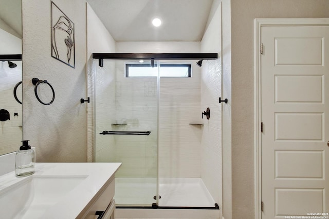 13019 Louberg, San Antonio, TX 78253 - full bath with a shower stall, vanity, and a textured wall
