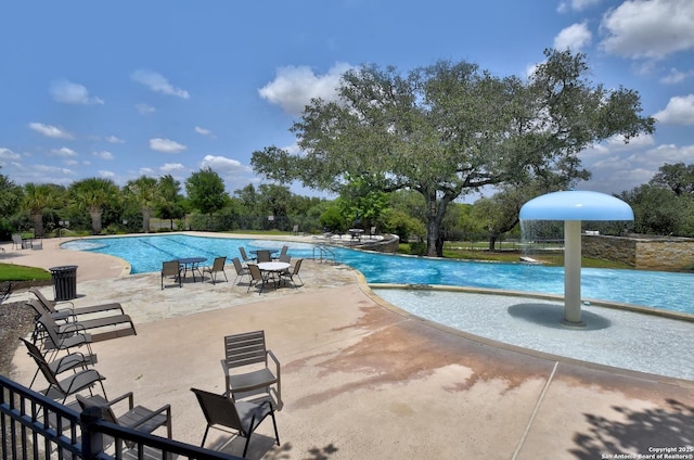 13019 Louberg, San Antonio, TX 78253 - community pool featuring a patio area and view of scattered trees