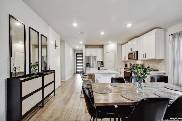 13019 Louberg, San Antonio, TX 78253 - dining room with light wood-style floors and recessed lighting