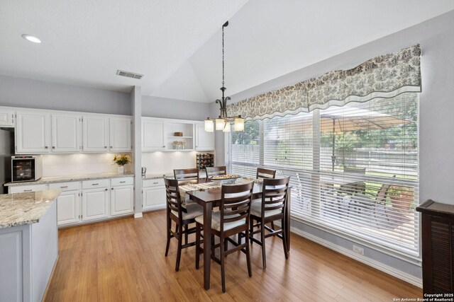 2723 Sierra Salinas, San Antonio, TX 78259 - dining room featuring light wood-type flooring and lofted ceiling
