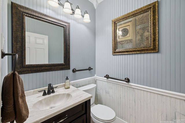 2723 Sierra Salinas, San Antonio, TX 78259 - half bath featuring wallpapered walls, vanity, and wainscoting