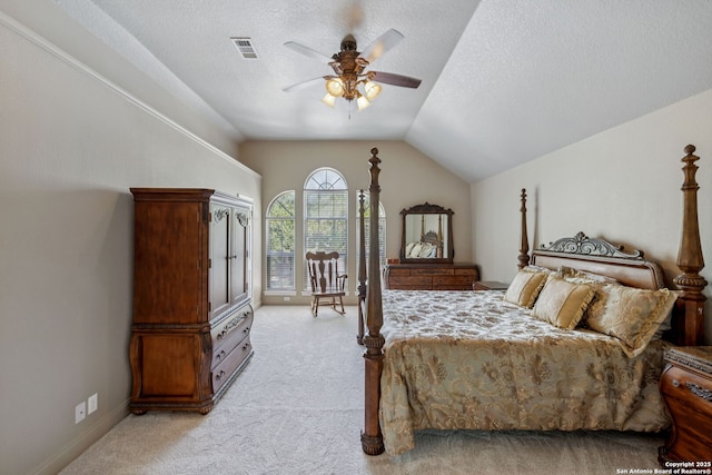 2723 Sierra Salinas, San Antonio, TX 78259 - bedroom with light colored carpet, lofted ceiling, access to exterior, a ceiling fan, and a textured ceiling