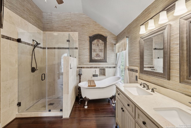 2723 Sierra Salinas, San Antonio, TX 78259 - bathroom with lofted ceiling, a stall shower, a freestanding tub, tile walls, and double vanity