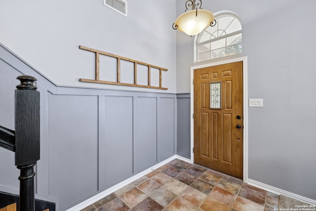2723 Sierra Salinas, San Antonio, TX 78259 - entrance foyer with stone finish floors and a decorative wall