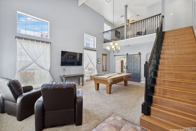 2723 Sierra Salinas, San Antonio, TX 78259 - carpeted living room featuring a towering ceiling, a barn door, stairway, a ceiling fan, and billiards table