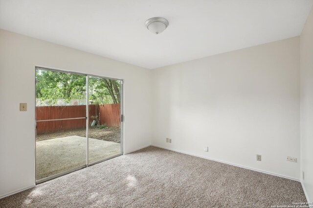 114 Crystal Cyn, Universal City, TX 78148 - unfurnished bedroom with access to outside and carpet