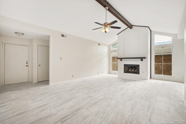 114 Crystal Cyn, Universal City, TX 78148 - unfurnished living room with ceiling fan, healthy amount of natural light, beamed ceiling, a fireplace, and high vaulted ceiling