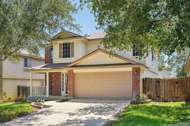 614 Granite Clf, San Antonio, TX 78251 - view of front of house featuring brick siding, driveway, covered porch, an attached garage, and roof with shingles