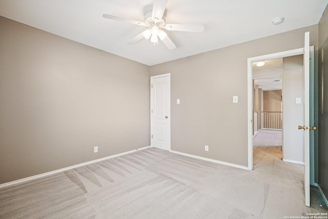 614 Granite Clf, San Antonio, TX 78251 - unfurnished bedroom with light carpet and ceiling fan