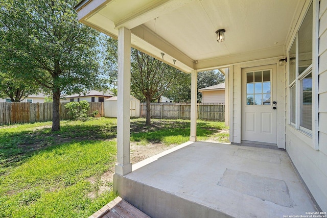 614 Granite Clf, San Antonio, TX 78251 - fenced backyard featuring a patio area and a storage shed