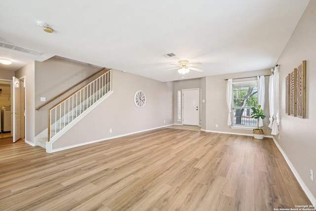 614 Granite Clf, San Antonio, TX 78251 - unfurnished living room with a ceiling fan, stairs, light wood-style flooring, and washer / clothes dryer