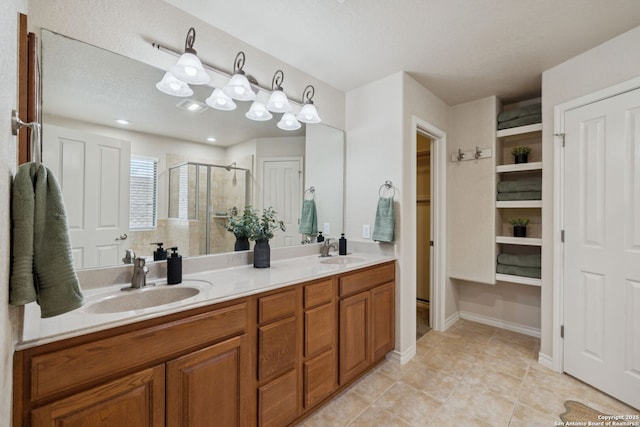 3535 Arroyo Grande, San Antonio, TX 78253 - full bathroom featuring a shower stall, double vanity, tile patterned floors, and a walk in closet