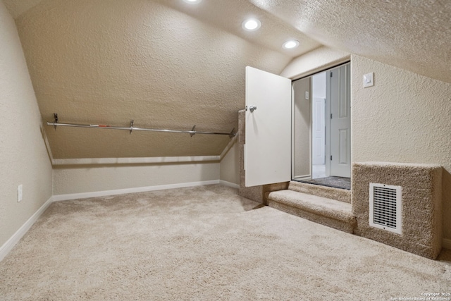 3535 Arroyo Grande, San Antonio, TX 78253 - bathroom with a textured wall, a textured ceiling, vaulted ceiling, and recessed lighting