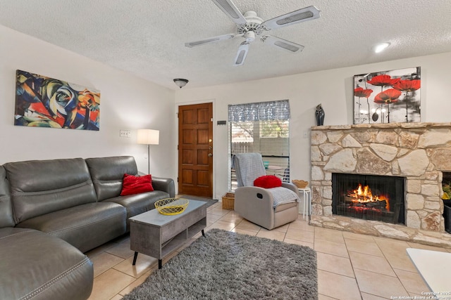5322 Medical Unit A102, San Antonio, TX 78240 - tiled living room with a fireplace, a textured ceiling, and ceiling fan
