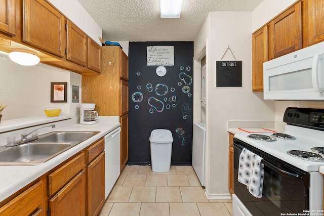 5322 Medical Unit A102, San Antonio, TX 78240 - kitchen with white appliances, light countertops, brown cabinetry, a textured ceiling, and light tile patterned flooring