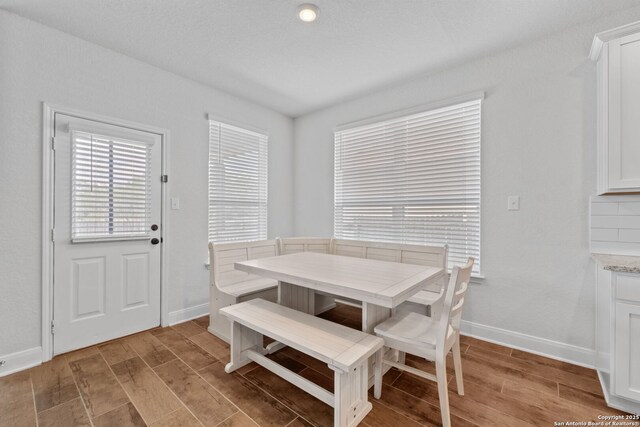 3415 Iron Cyn, Bulverde, TX 78163 - dining space with light wood-style floors and baseboards