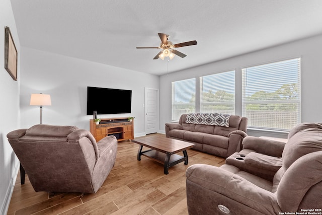 3415 Iron Cyn, Bulverde, TX 78163 - living room featuring ceiling fan and light wood-style floors
