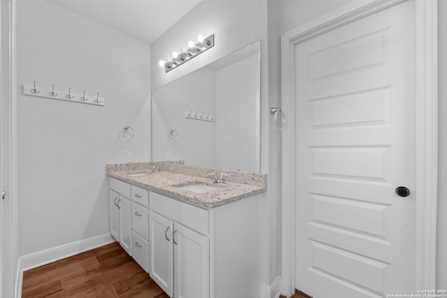 3415 Iron Cyn, Bulverde, TX 78163 - bathroom featuring double vanity and wood finished floors