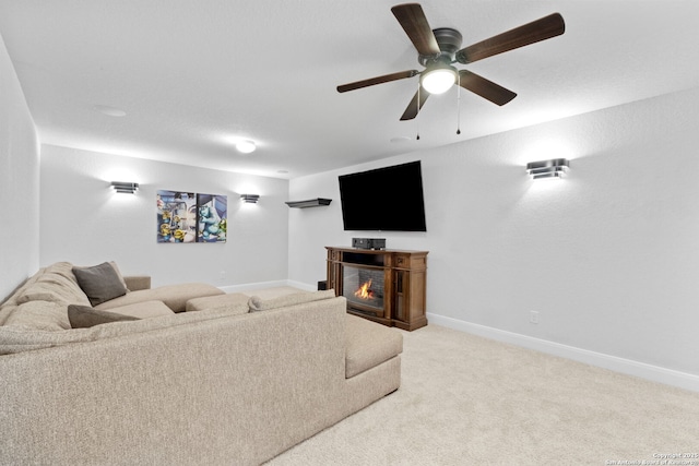 3415 Iron Cyn, Bulverde, TX 78163 - living room with a warm lit fireplace, carpet flooring, and ceiling fan