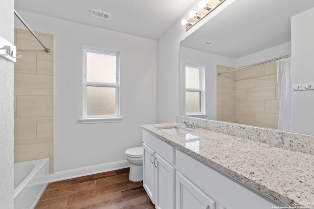 3415 Iron Cyn, Bulverde, TX 78163 - bathroom with vanity, wood finished floors, and shower / tub combo