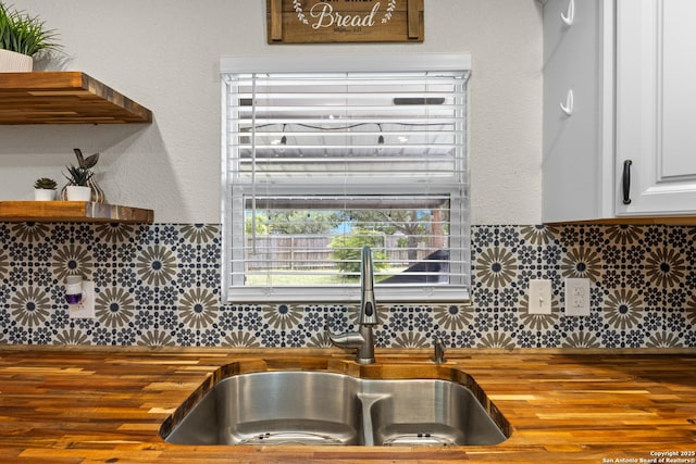 6402 Quiet Frst, San Antonio, TX 78239 - kitchen with butcher block counters and decorative backsplash