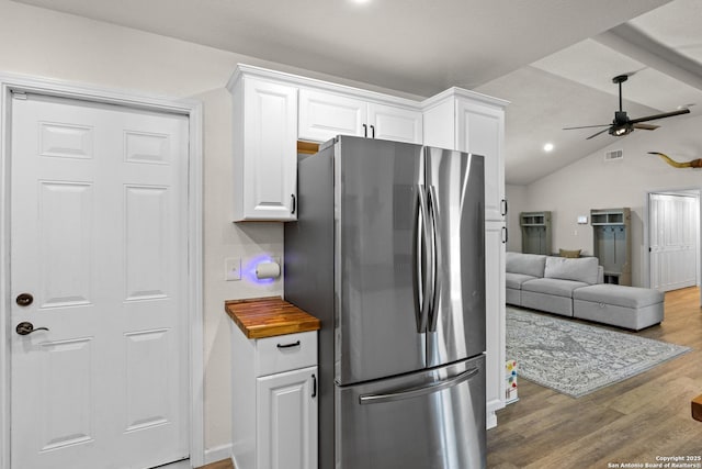 6402 Quiet Frst, San Antonio, TX 78239 - kitchen with freestanding refrigerator, white cabinetry, ceiling fan, wood finished floors, and lofted ceiling