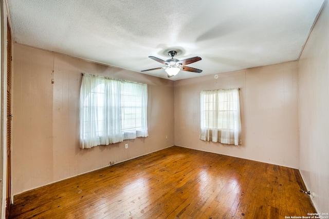606 W Baetz Blvd, San Antonio, TX 78221 - spare room featuring healthy amount of natural light, a ceiling fan, and hardwood / wood-style flooring