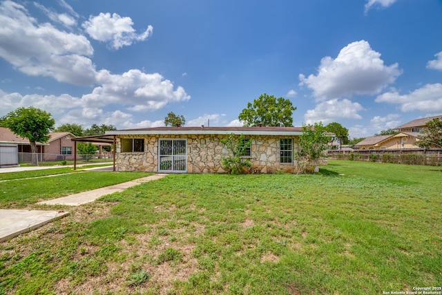 606 W Baetz Blvd, San Antonio, TX 78221 - view of front facade with stone siding and a carport