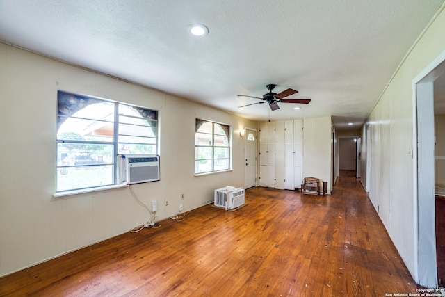 606 W Baetz Blvd, San Antonio, TX 78221 - unfurnished living room featuring hardwood / wood-style flooring, ceiling fan, cooling unit, and recessed lighting