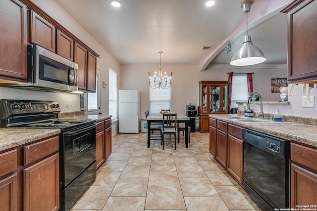 1038 Marquette, San Antonio, TX 78228 - kitchen featuring black appliances, a chandelier, hanging light fixtures, recessed lighting, and light tile patterned flooring