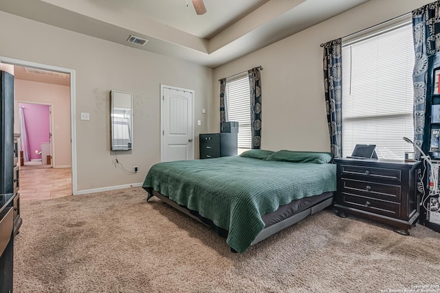 1038 Marquette, San Antonio, TX 78228 - carpeted bedroom featuring a tray ceiling and ceiling fan