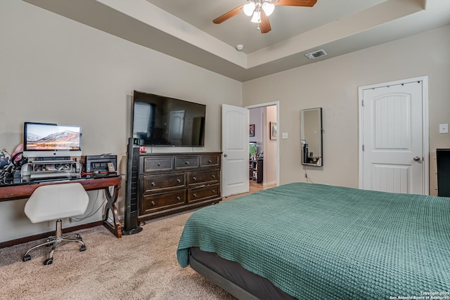 1038 Marquette, San Antonio, TX 78228 - carpeted bedroom featuring a tray ceiling, a desk, and ceiling fan