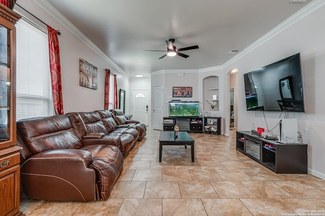 1038 Marquette, San Antonio, TX 78228 - living room featuring ceiling fan, ornamental molding, and arched walkways