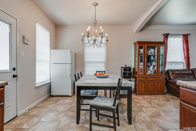 1038 Marquette, San Antonio, TX 78228 - dining space with a chandelier, healthy amount of natural light, and light tile patterned floors