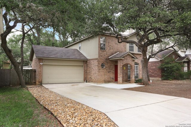 4239 Knollpass, San Antonio, TX 78247 - traditional home with brick siding, driveway, and an attached garage