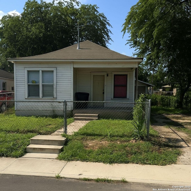 135 Roberts, San Antonio, TX 78207 - bungalow featuring covered porch, a fenced front yard, and a gate