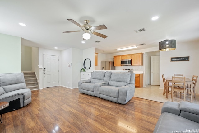 6410 Ruffled Grouse, San Antonio, TX 78233 - living area featuring light wood-style flooring, recessed lighting, stairway, and a ceiling fan