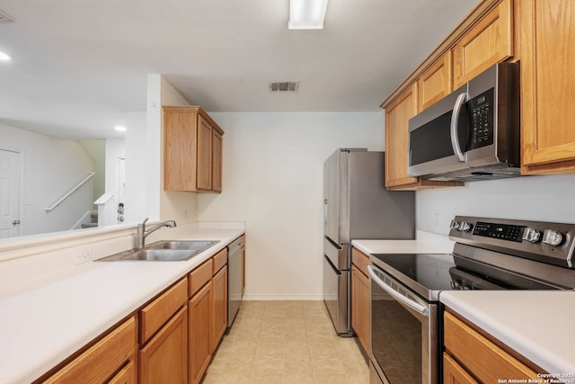 6410 Ruffled Grouse, San Antonio, TX 78233 - kitchen with stainless steel appliances, light countertops, recessed lighting, and brown cabinets