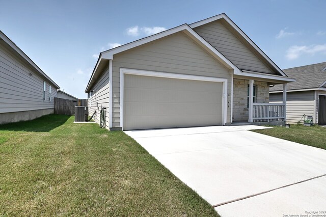 10746 Margarita Loop, Converse, TX 78109 - view of front of home with a garage, a front lawn, driveway, and stone siding